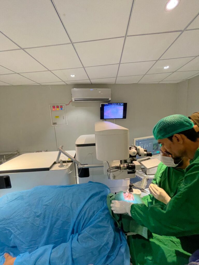 Patient undergoing laser eye care treatment in a modern eye clinic with specialist equipment